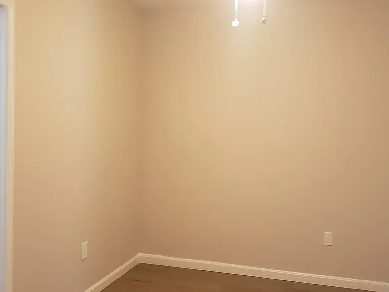 Queen size bed sleeping area and closet entrance