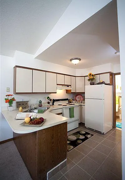 Open kitchen with breakfast bar in 1 & 2 BR Ranch Series