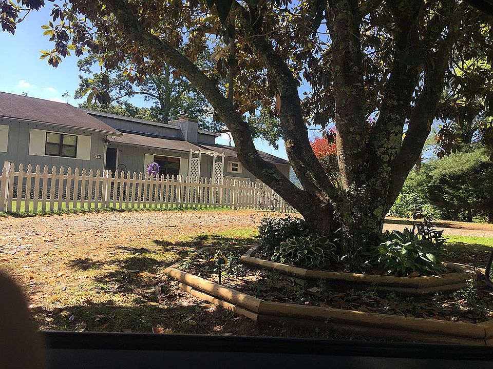 Fenced yard and flower bed