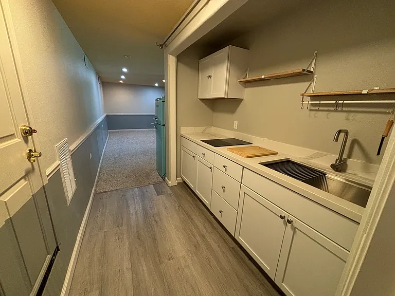 kitchen into living room. sliver of fridge can be seen.