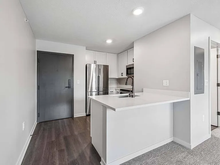 A sleek breakfast bar and contemporary finishes create a welcoming space that effortlessly connects cooking, dining, and everyday living.