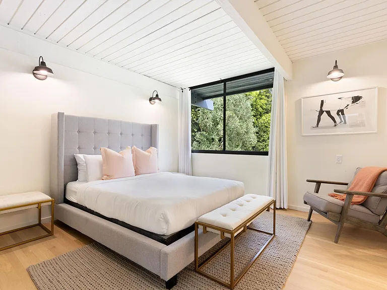 Enjoy plentiful light and an extremely comfortable bed in Guest Bedroom 1