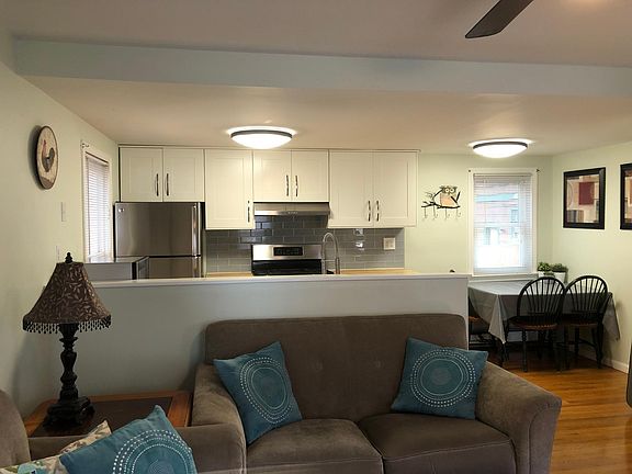 Living room with view of kitchen and dining area