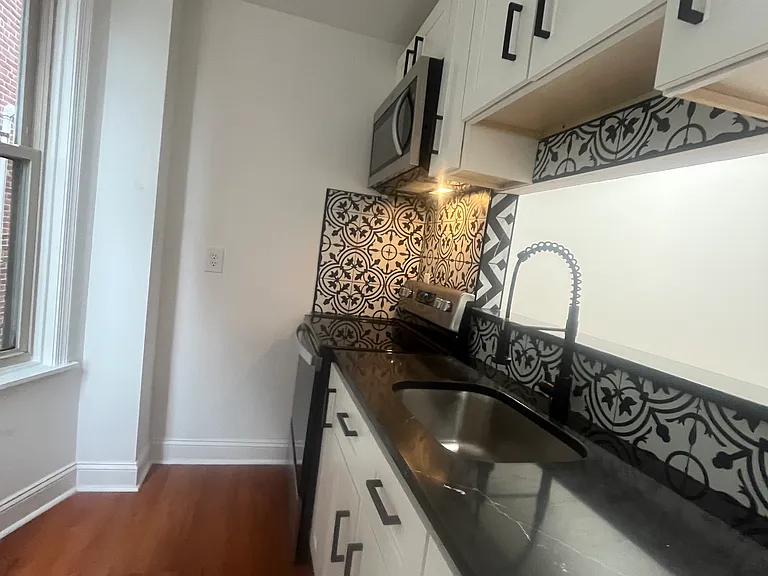 Kitchen between the living room and front bedroom.