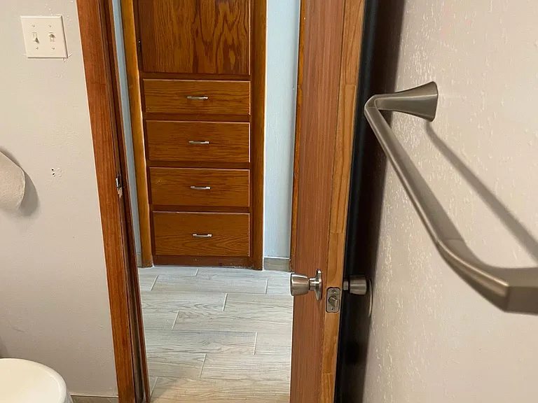 Bathroom to hall and linen storage