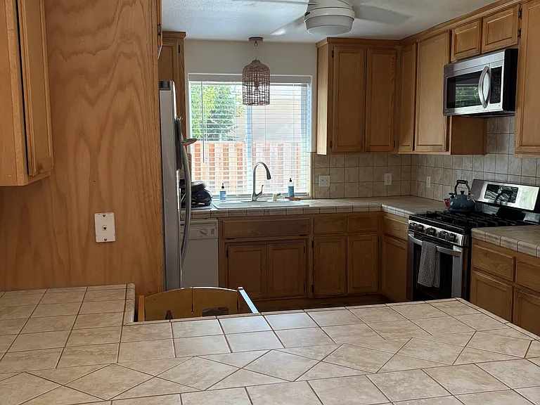Kitchen with gas range and new appliances