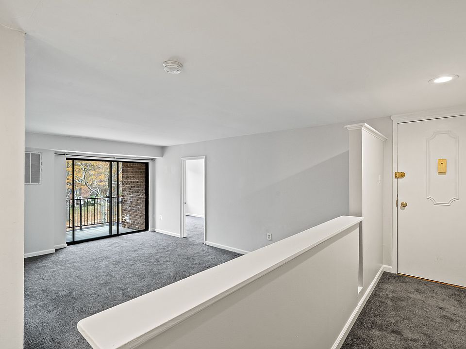 Entry Way and Living Room - Front Bedroom door in the back ground