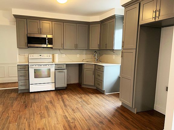 New Kitchen with new cabinets, quartz counters, tile floor