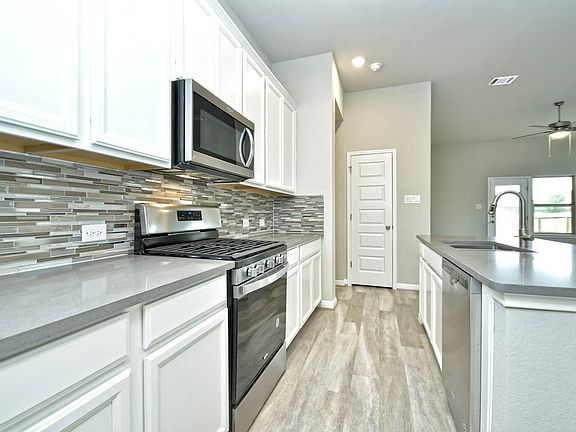 Kitchen in the San Saba floorplan at a Meritage Homes community.