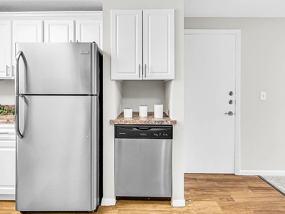 Revel in our updated kitchens featuring a stainless-steel appliance ensemble that includes a stove, microwave, refrigerator, and dishwasher.