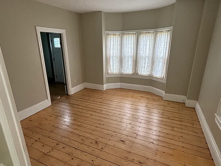 living room connected to dining room, entry to stairwell