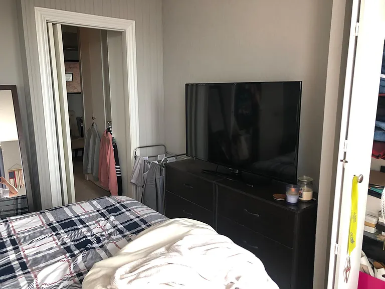 Bedroom w/ smaller shelving/closet