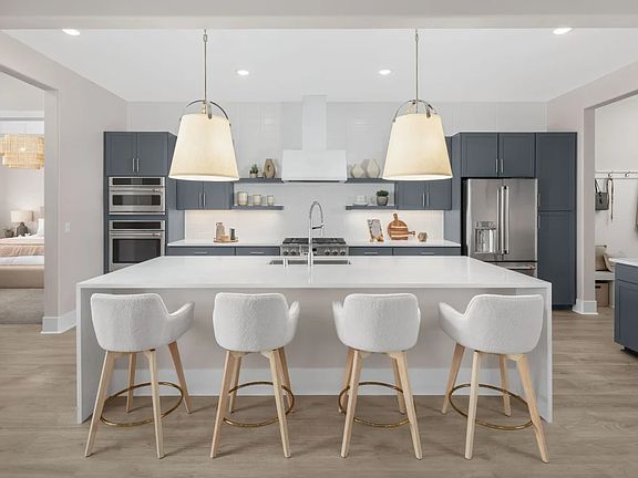 Kitchen with pendant lighting and floating shelves