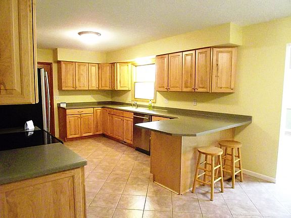 Updated Kitchen with natural stain cherry cabinets