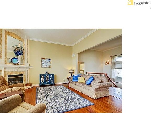 Soaring ceilings, crown molding, newer hardwood floors