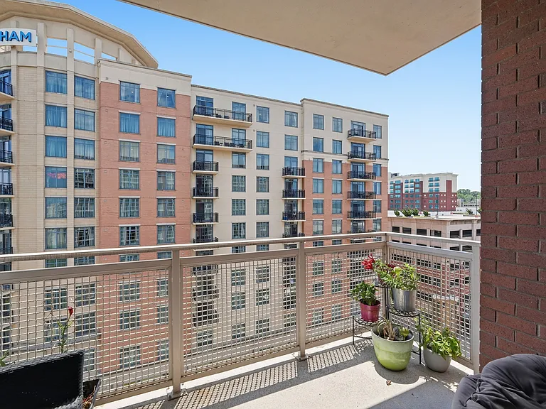 Balcony overlooking the surrounding neighborhood and skyline