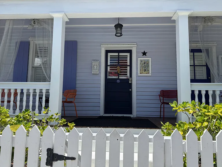 Yard is fenced and has a easy step up to the lovely front porch.