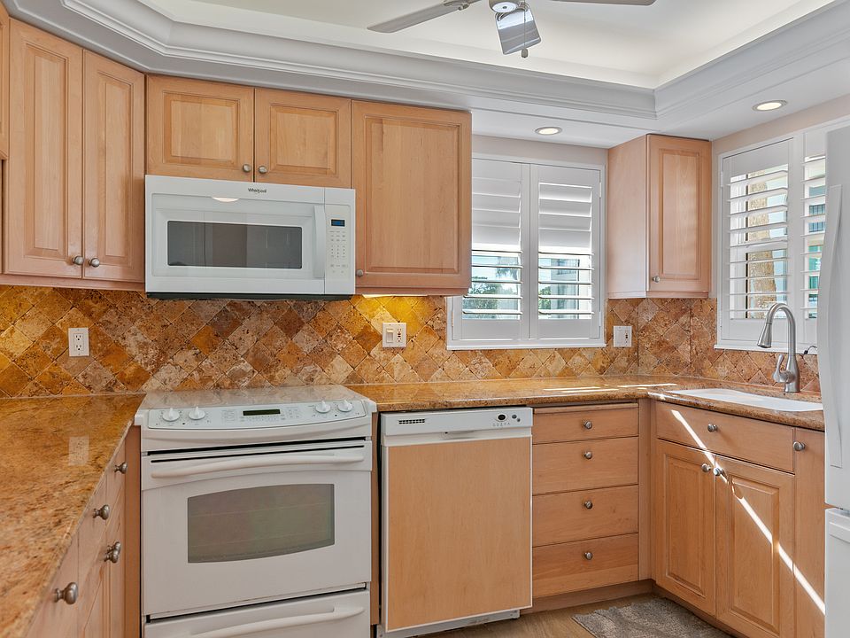 2 windows in the kitchen with plantation shutters