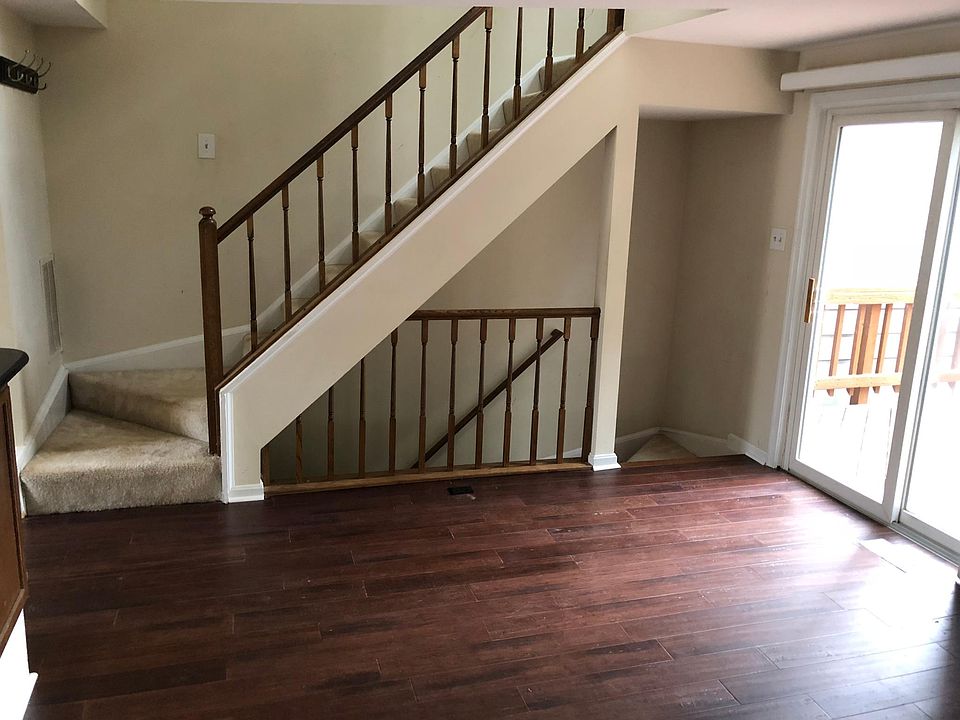Main level with half bath. Stairs go up to master bedroom level. Stairs go down to 2nd bedroom and laundry room