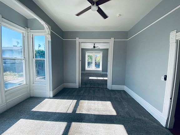 View from Master Bedroom into joined Living Room (separated by beautiful antique pocket doors).