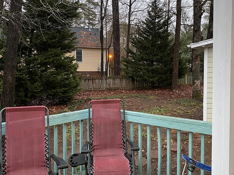 Large, fenced, private back yard with deck and storage shed.