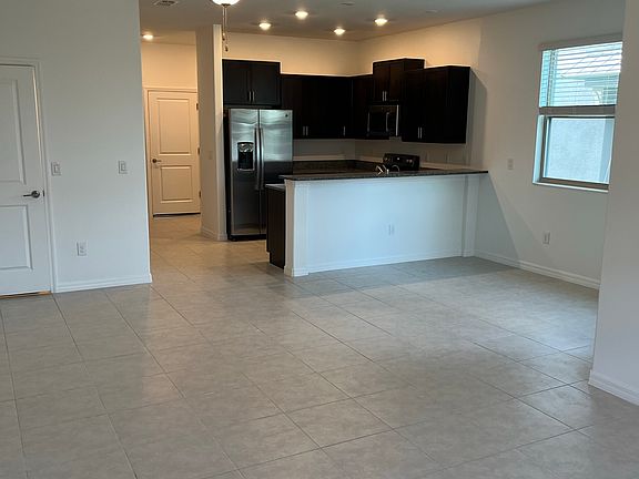 Open-Concept Living: Kitchen, Dining, Living Room, and Clever Under-Stair Storage