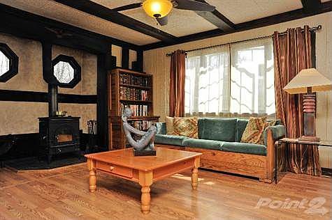 Warm and Cozy Living Room Features Vermont Casting Wood Burning Stove