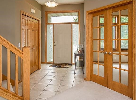 Just inside the front door is a ceramic tiled entryway, with access to the mudroom, office and upper level.