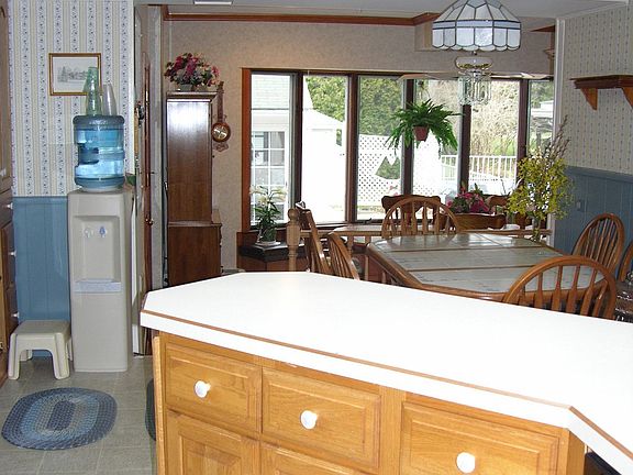 The open kitchen looks out to the patio and pool