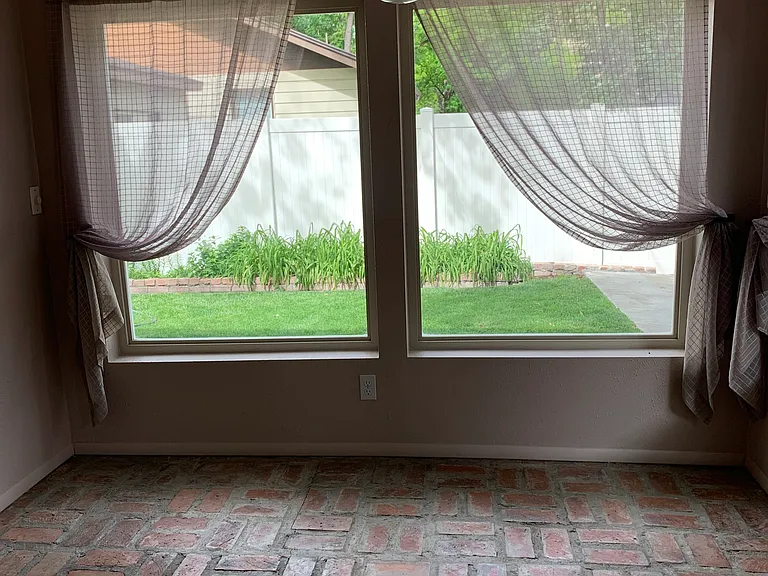 Sun room windows facing east towards the back yard