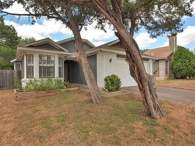 Recent paint on exterior with drought tolerant landscaping. Grass greens up nicely when the rains come.