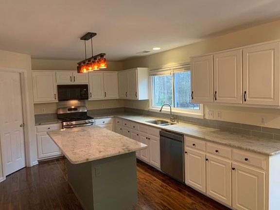 Kitchen, new countertops and refinished cabinets
