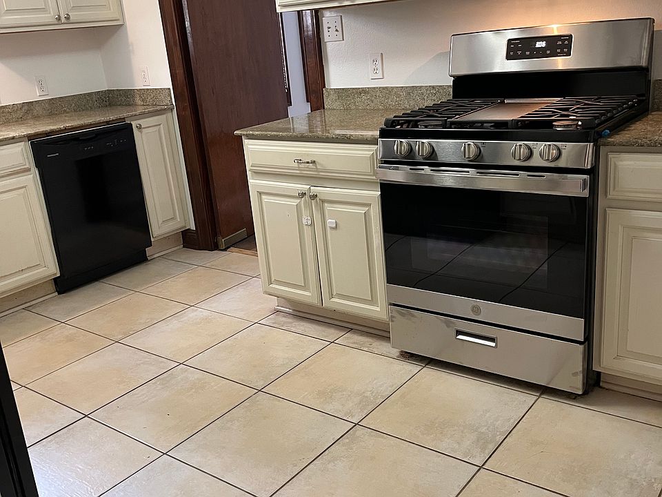 Kitchen with new range appliances. Gas stove.