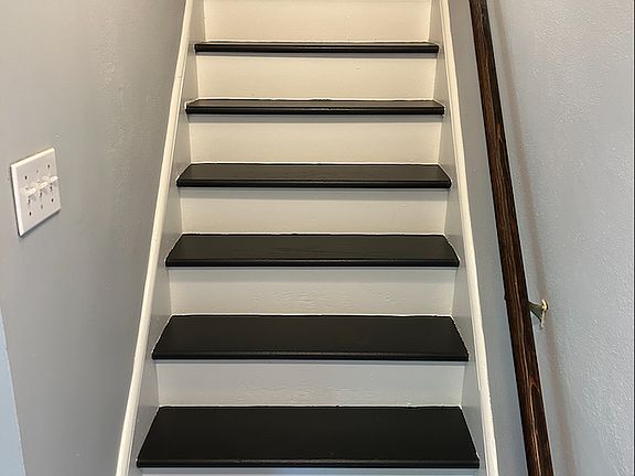 stairs to third bedroom and 2nd bathroom