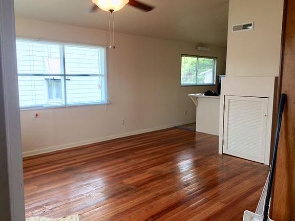Pic of floor before re-finished! Open airy Living room/dining room/kitchen