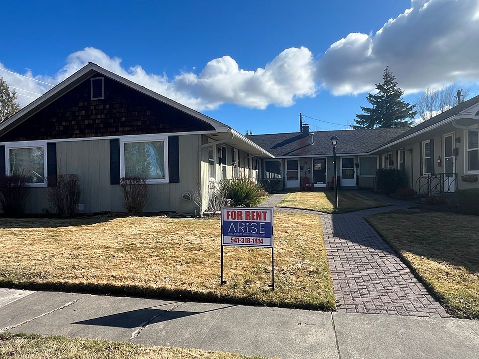 The home is located at the back of the property on the left side. #4