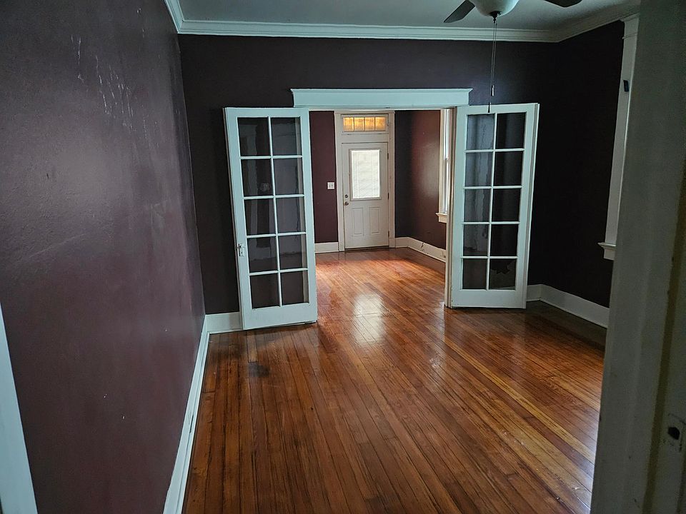 TWO FRONT ROOMS SHOWING FRENCH DOORS