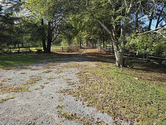 Private drive leading up to the property with a gate at the entrance