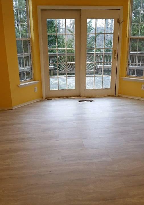 Sliding French doors lead to large back deck.