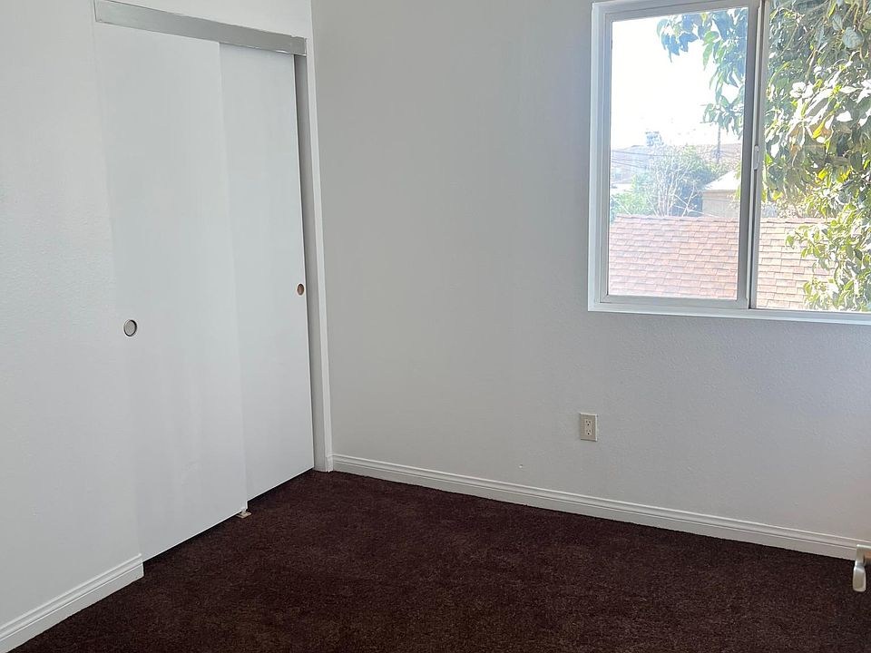One of the bedrooms. 4 bedrooms in this unit. They all have new carpet.