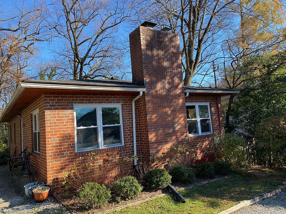 Front of house with flower beds.