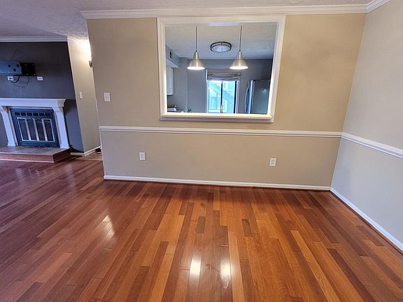 Dining Room with peek through window to kitchen