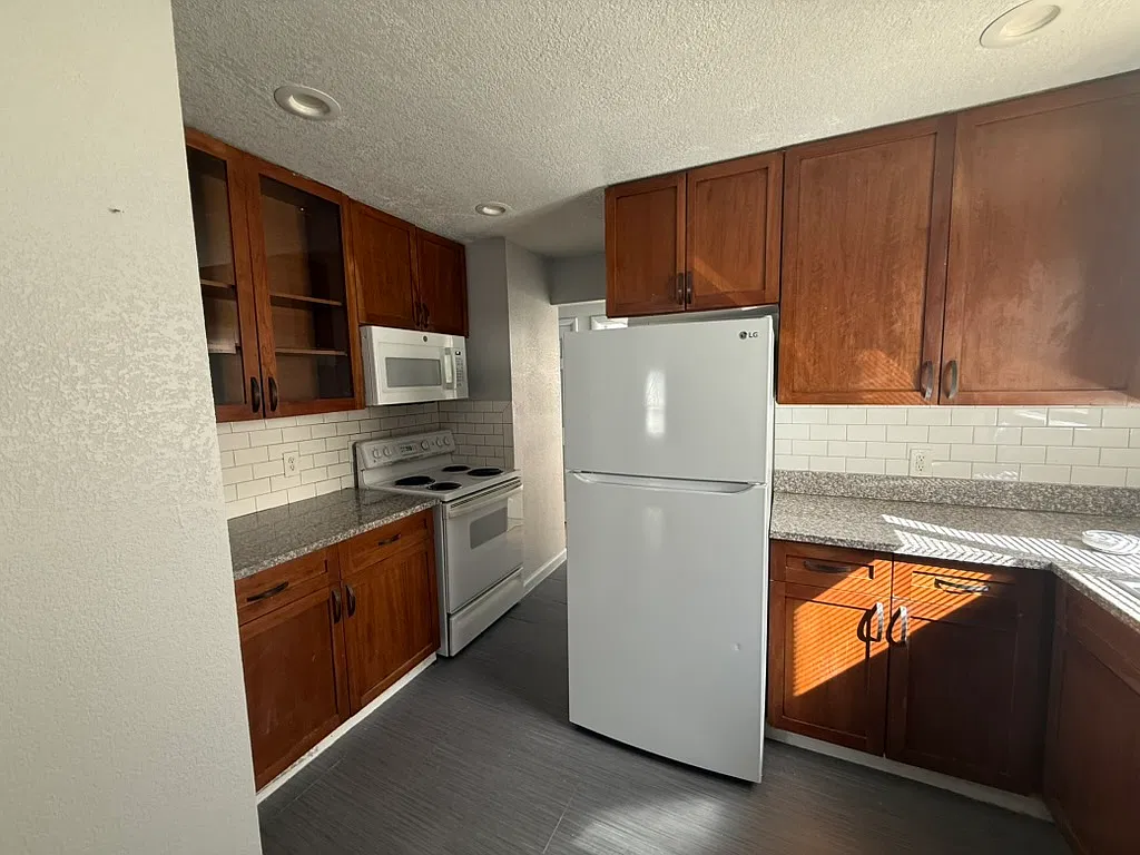 Updated 3-Bedroom, 1-Bathroom, Aurora Home with Private Yard & Parking — Photo 3