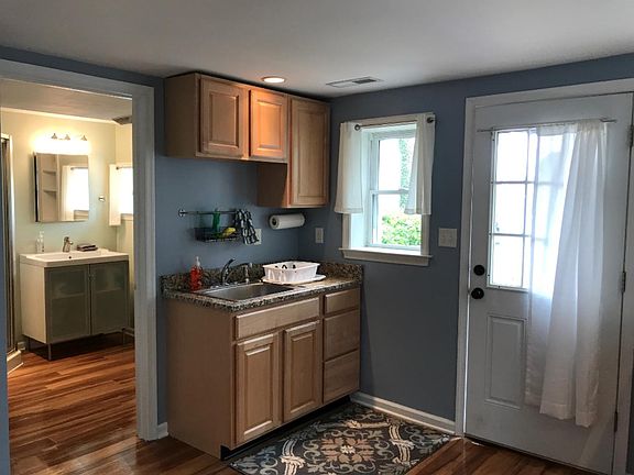 Private patio entrance leads in to a well-appointed and spacious kitchen and bath.