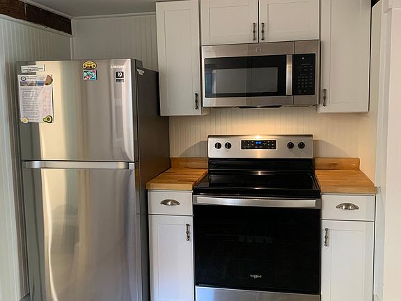 Kitchen has full size stove, built in microwave & full size fridge.