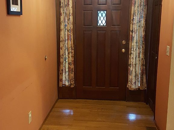 Wood floor entry opens to FR