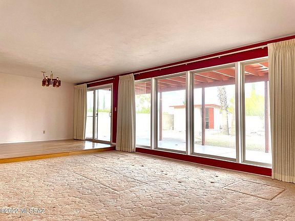 Large living room / dining room with full backyard view.