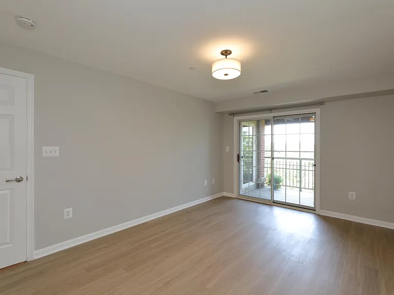 Master bedroom with view of balcony