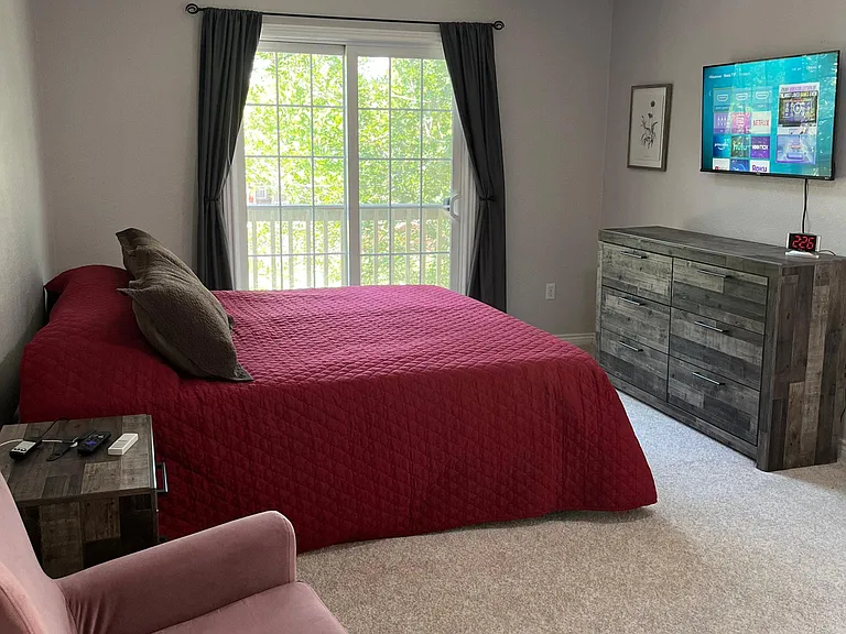 Primary suite is big enough for a king bed, chair, dresser, en-suite and walk in closet. The Juliet patio adds a lovely touch of fresh air and light!