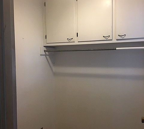 Laundry room with cabinets 